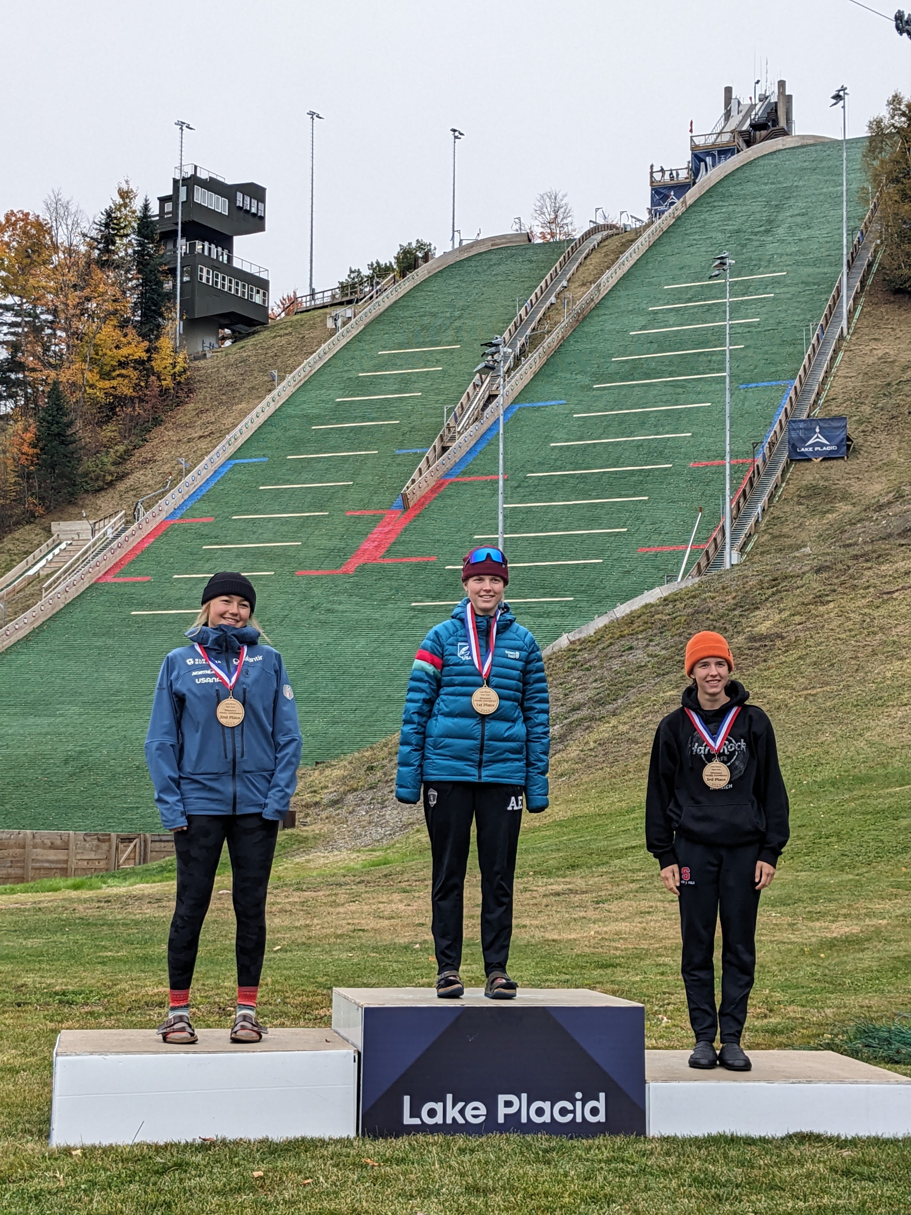 Women on the podium celebrating together
